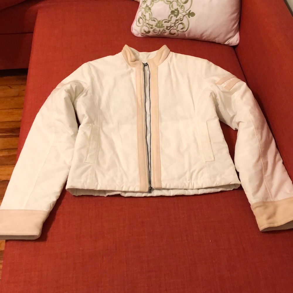 James Peres cream racer jacket with tan trim.